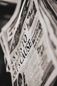 A close-up of a newspaper with bold headlines and articles.