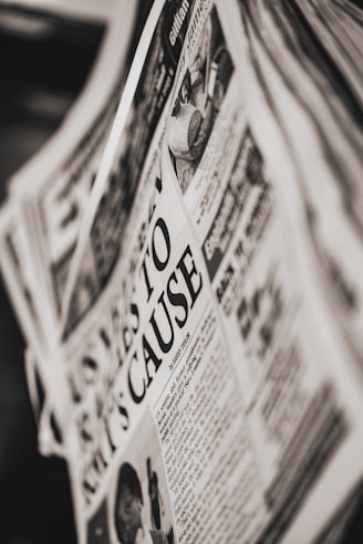 A close-up of a newspaper with bold headlines and articles.