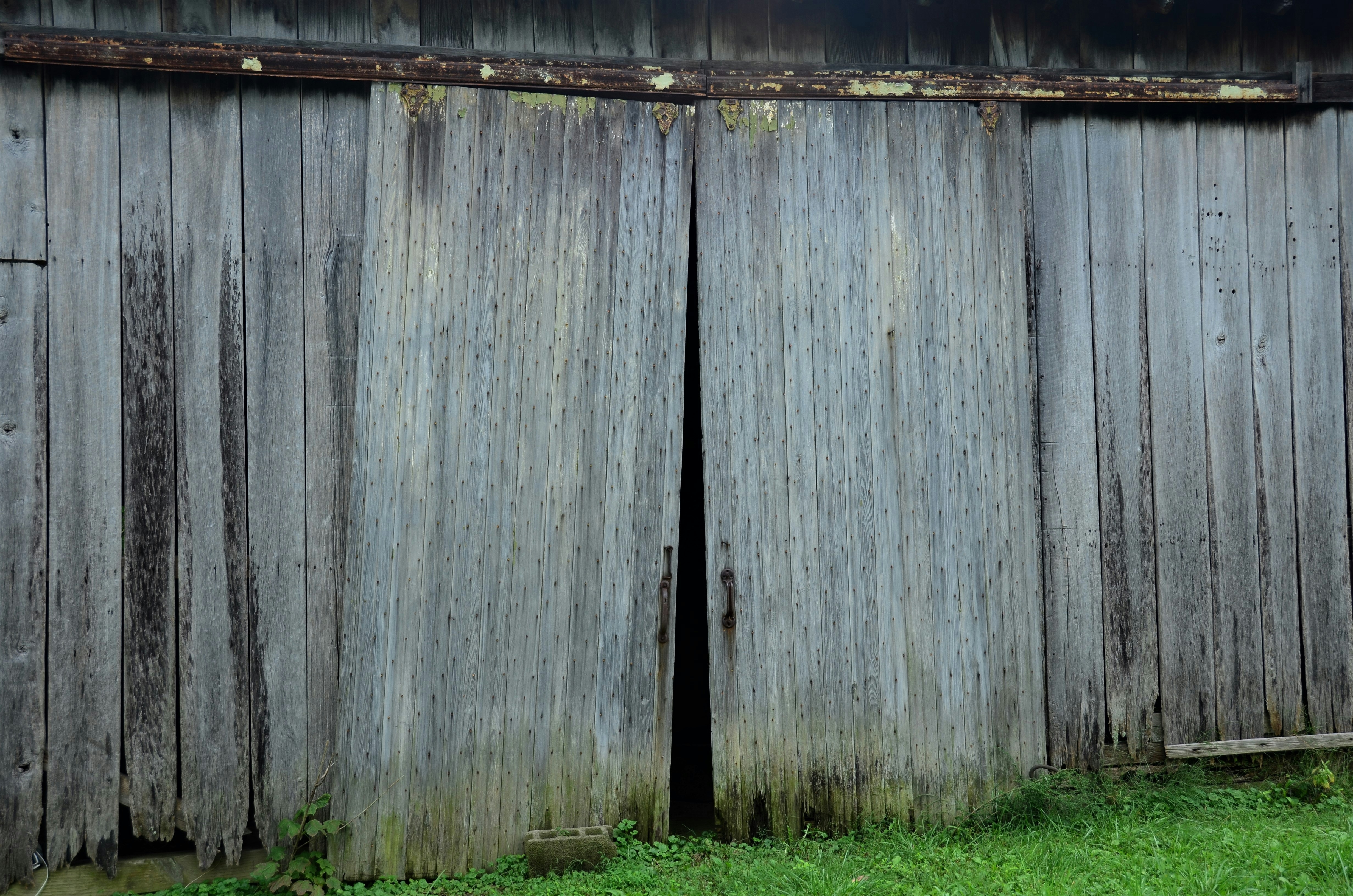 a fence with a green lawn
