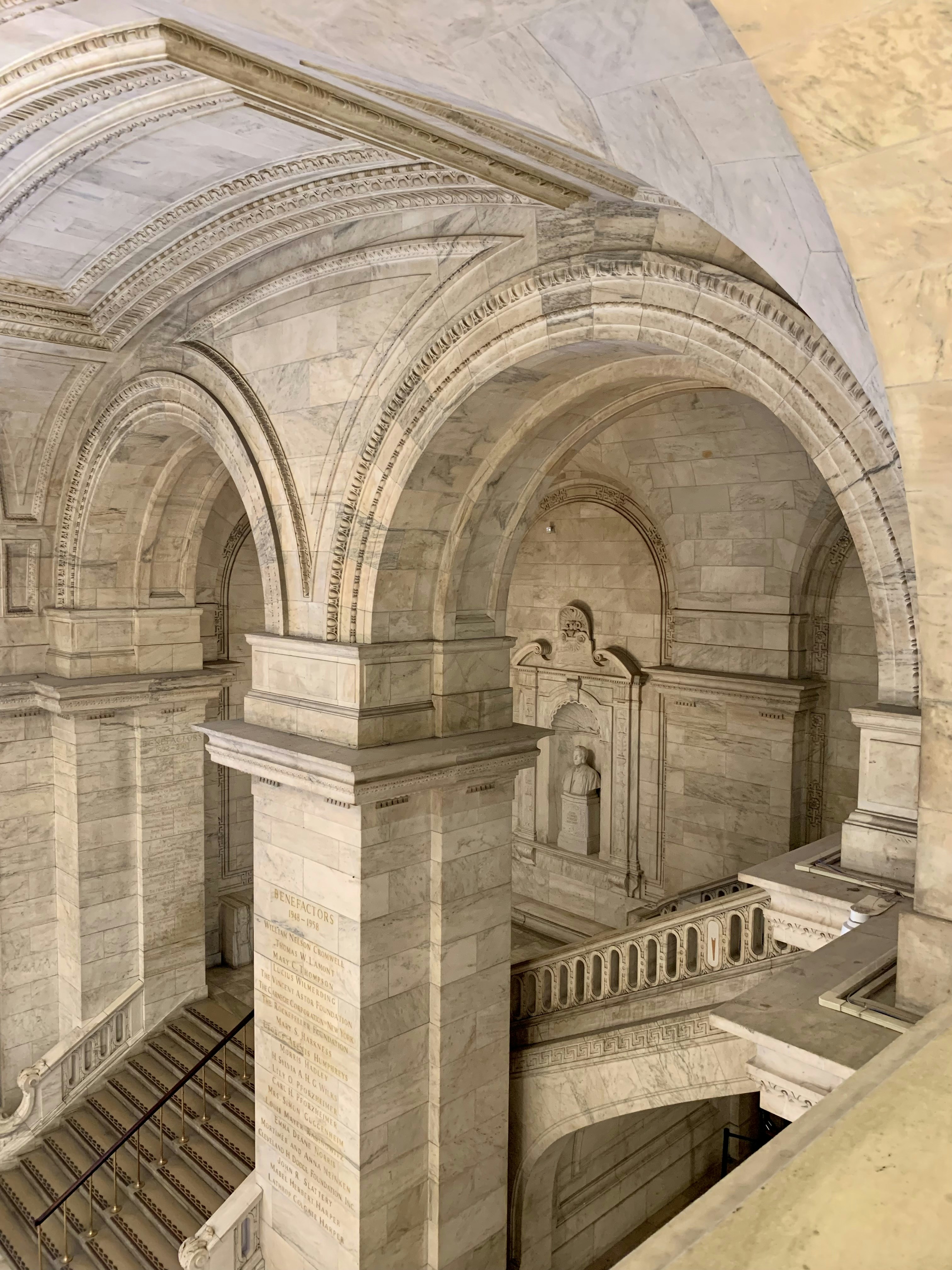 a large stone building with statues