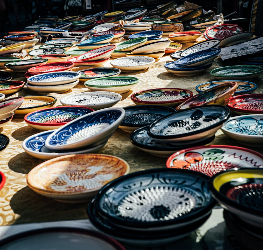 a group of bowls with colorful designs