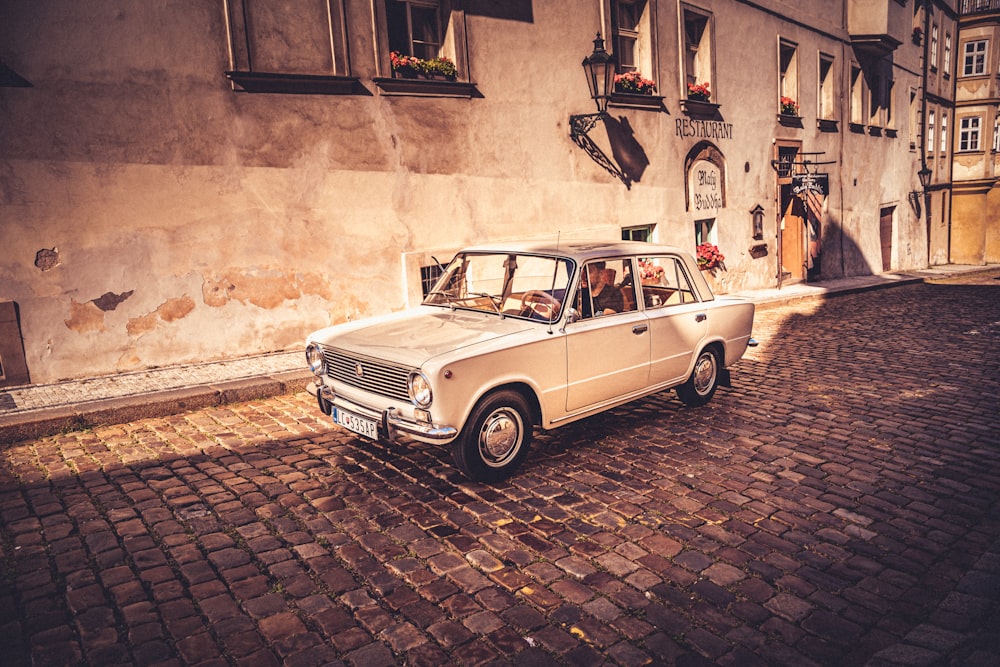 a car parked on a brick road