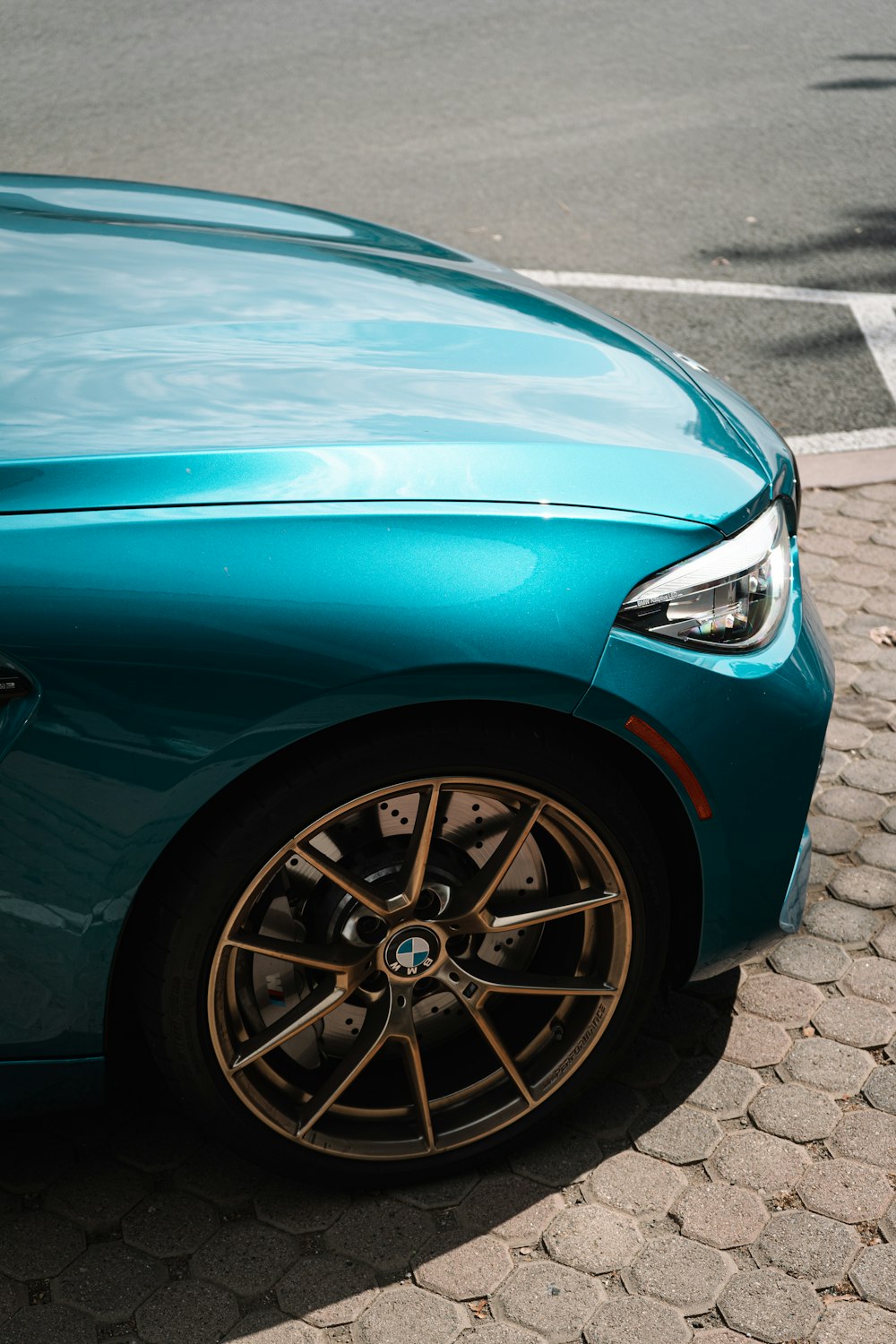 a blue car with a black rim