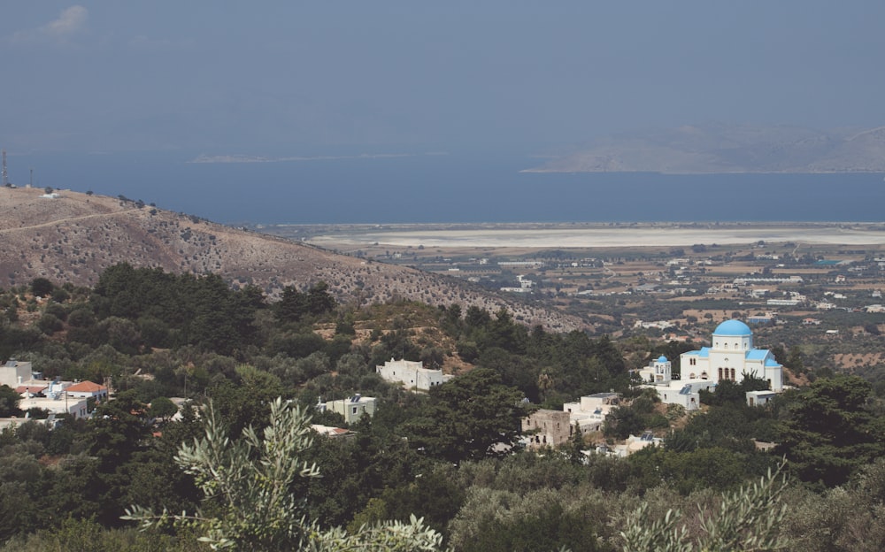 a town on a hill by the sea