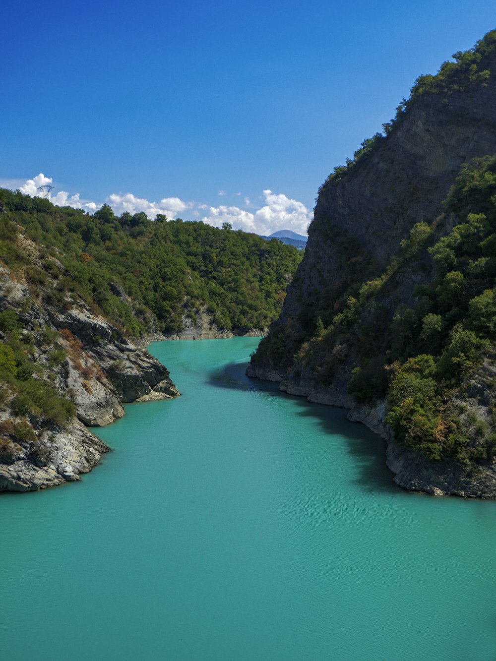 a body of water surrounded by mountains