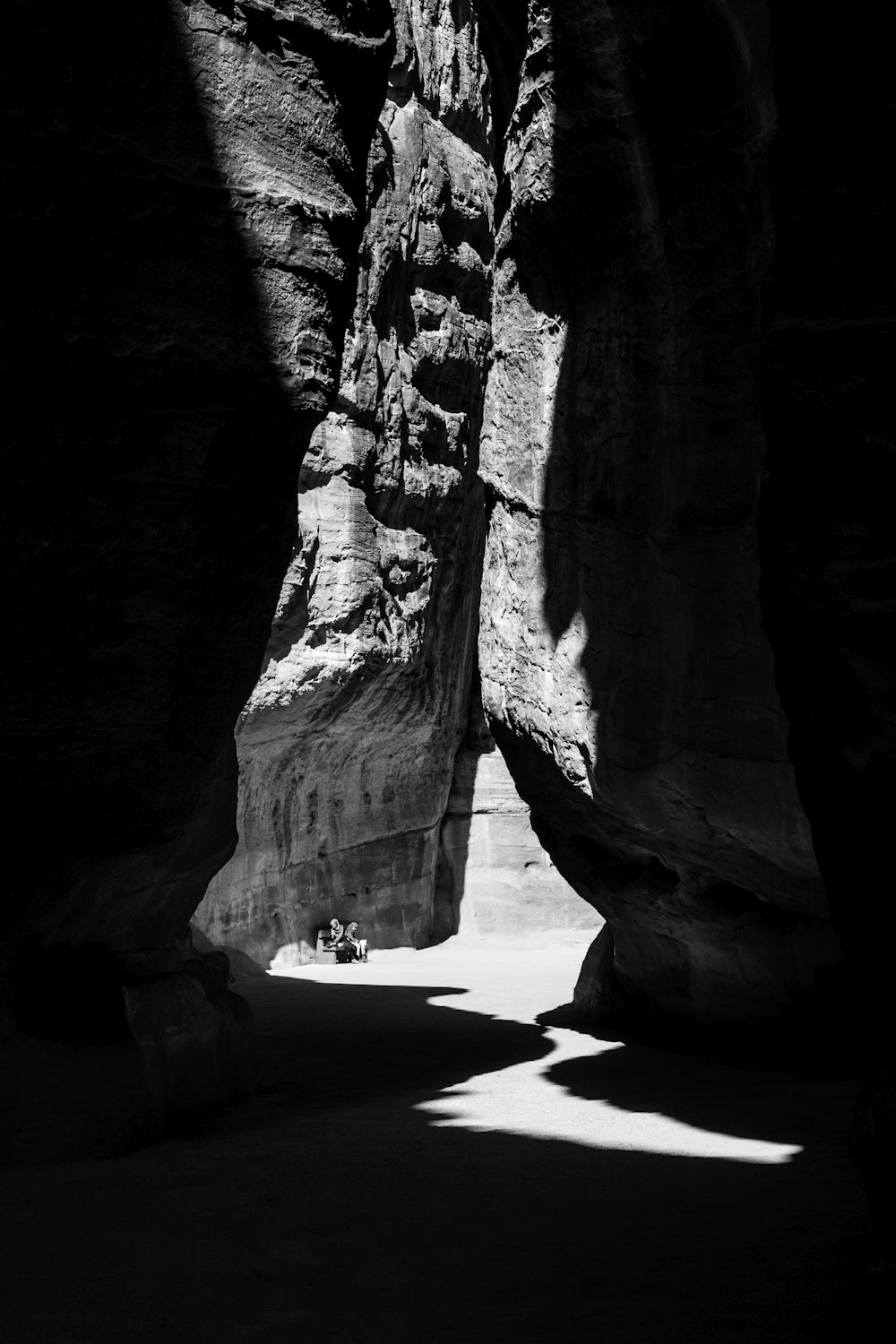 a person sitting in a cave