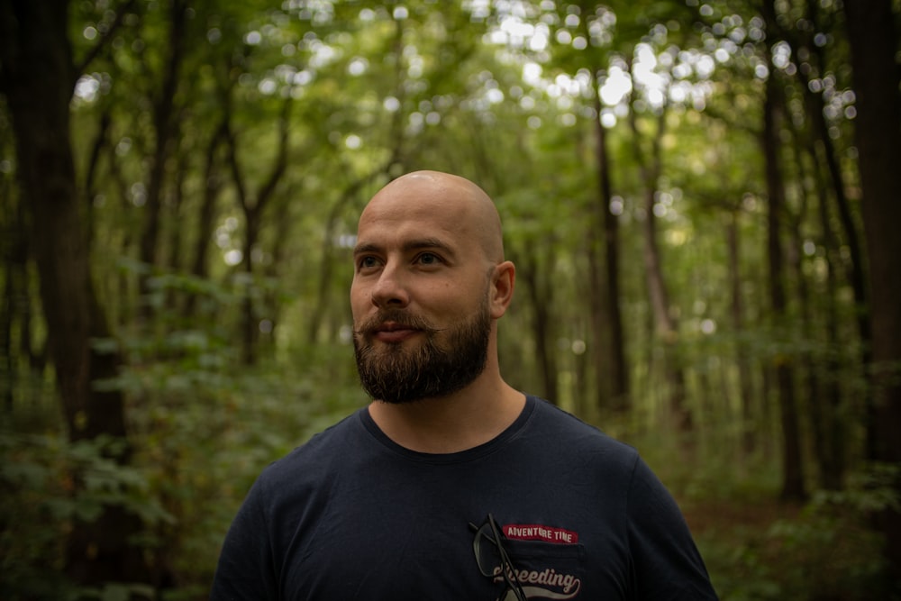 a man standing in a forest