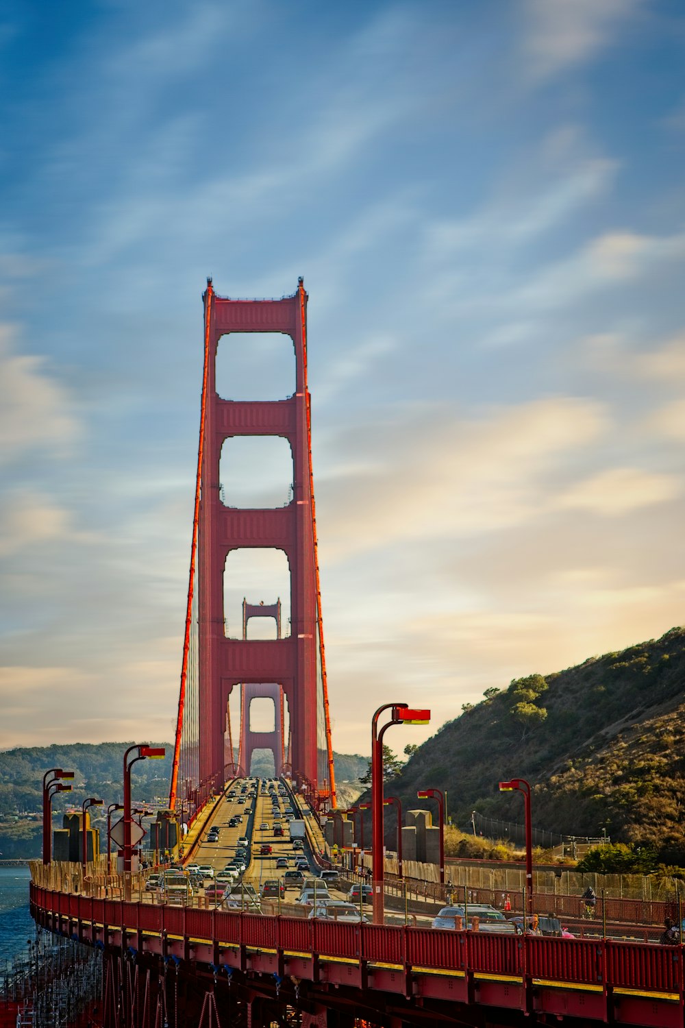 a large red bridge over water