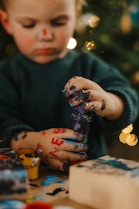 a baby holding a toy