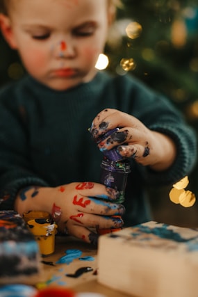 a baby holding a toy
