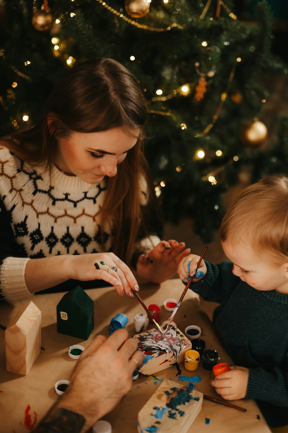 a person and a child painting