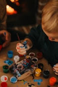 a child painting on a table