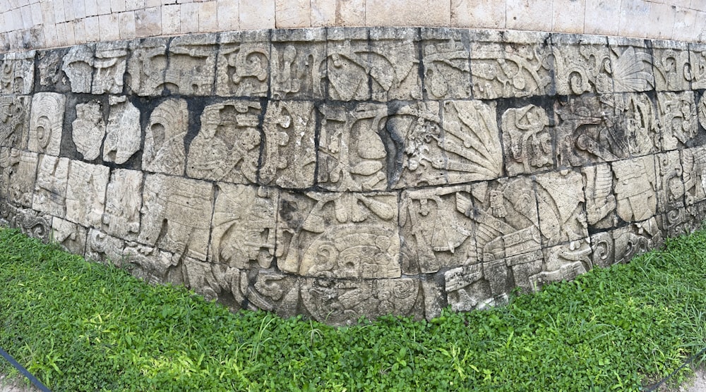 a stone wall with writing on it