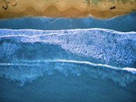 a wave crashing on a beach