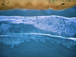 a wave crashing on a beach