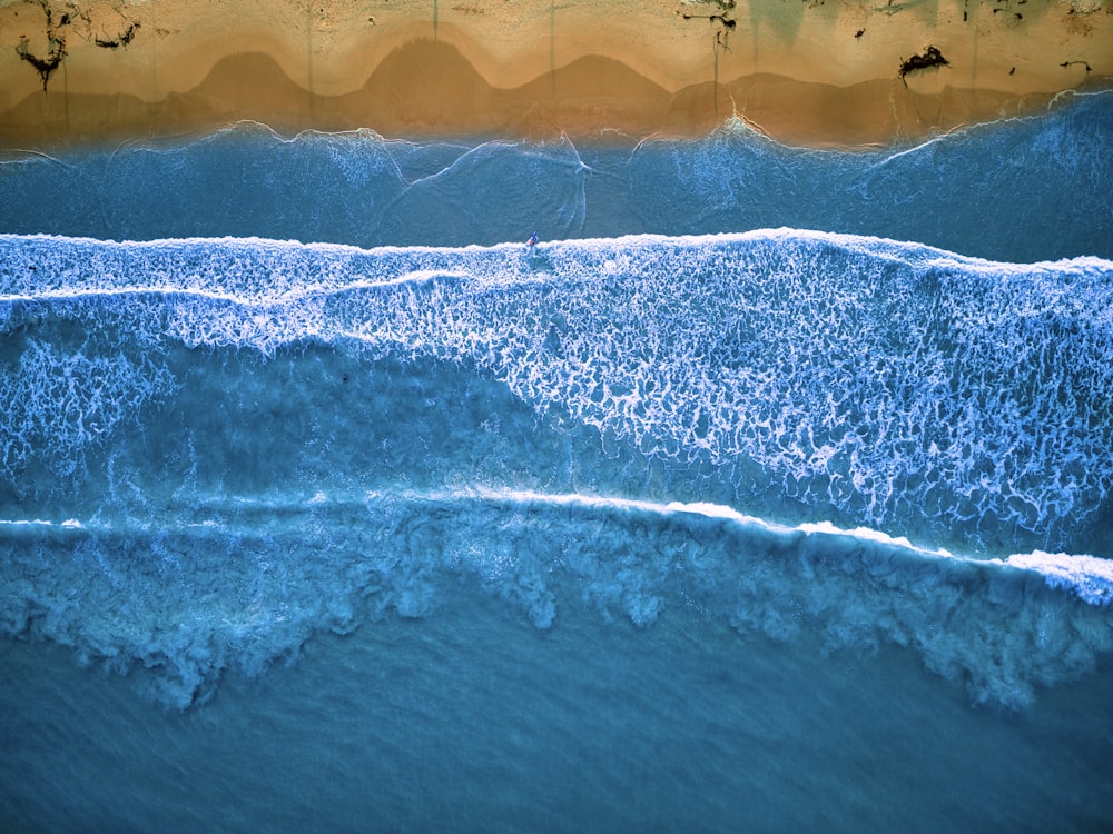 a wave crashing on a beach