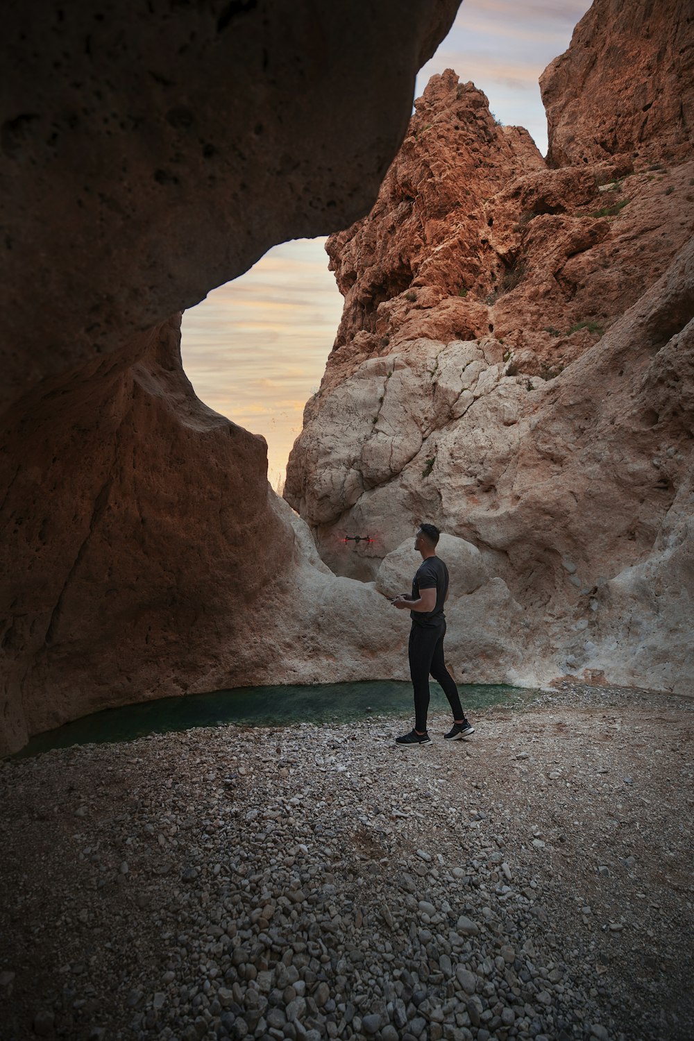 a man standing in a canyon
