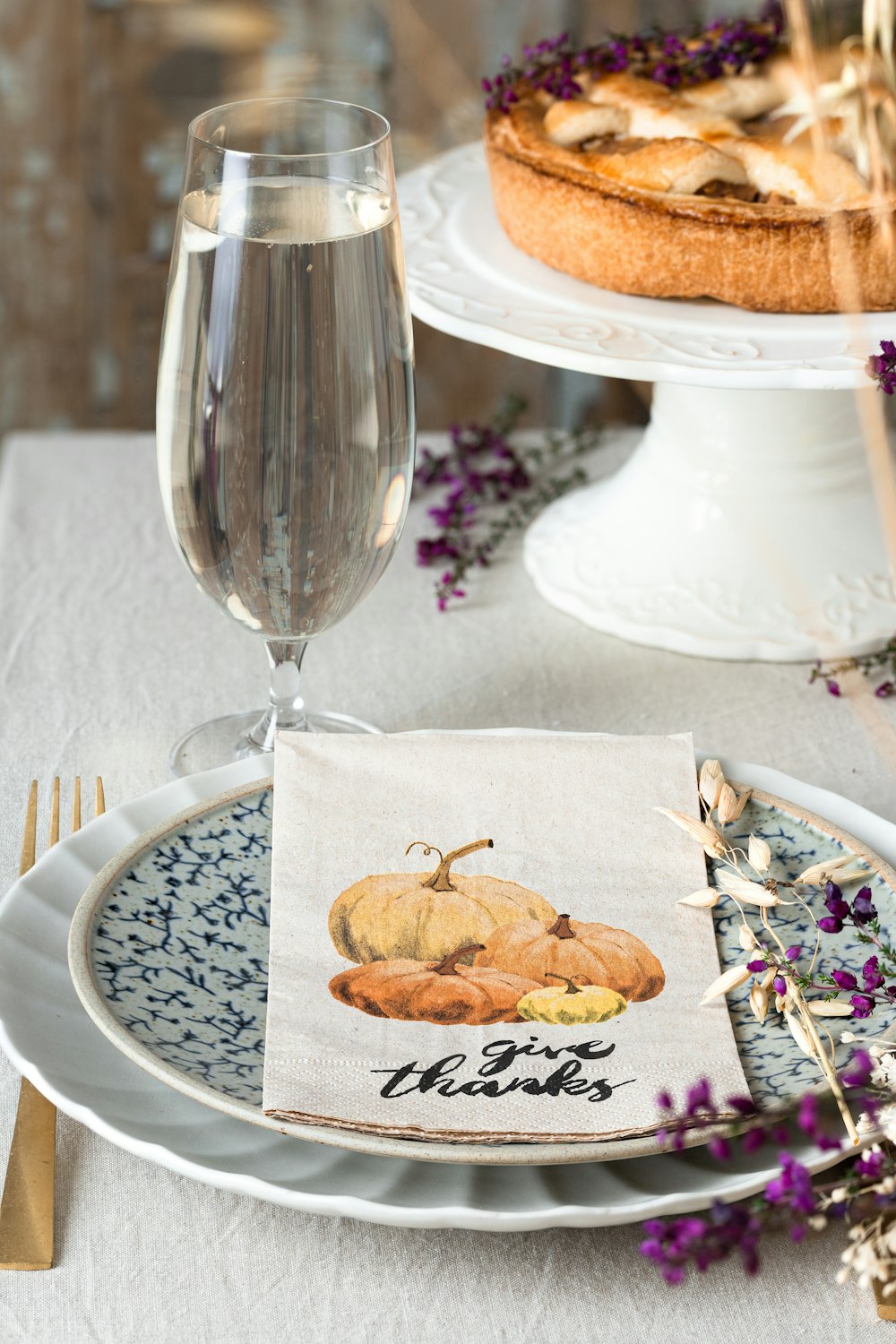 a plate of food and a glass of water on a table