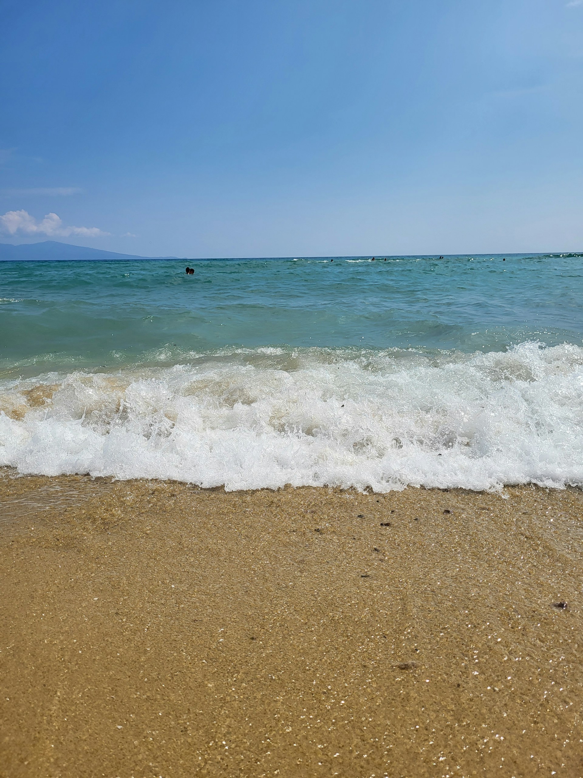 woman wearing yellow long-sleeved dress under white clouds and blue sky during daytime