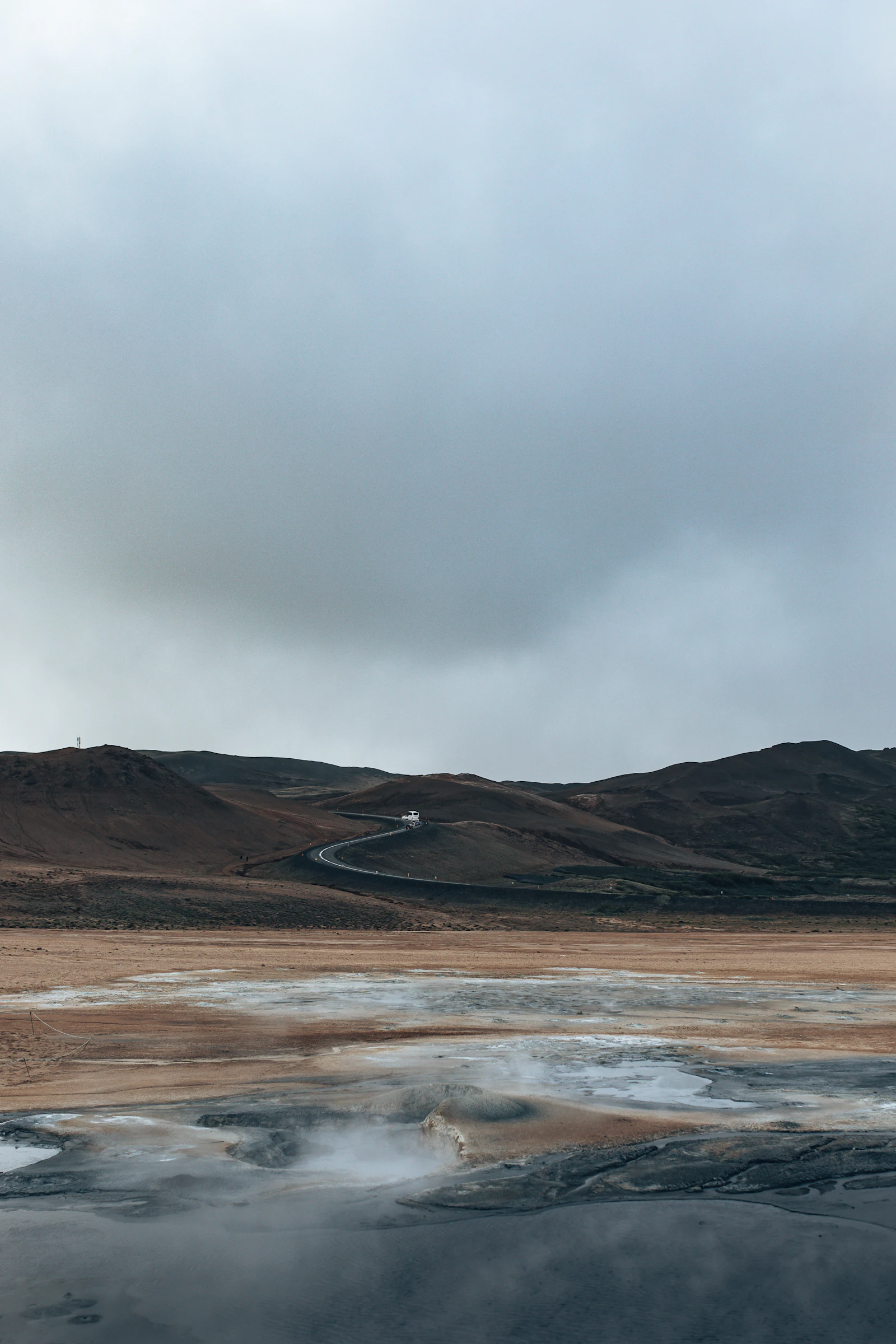 An Icelandic coastline and hill beside a regional route
