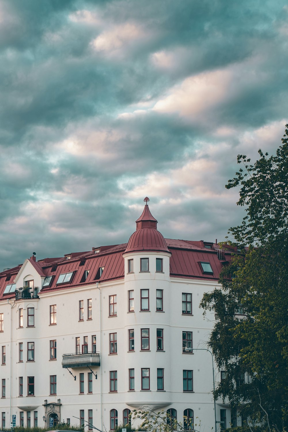 a building with a cloudy sky above