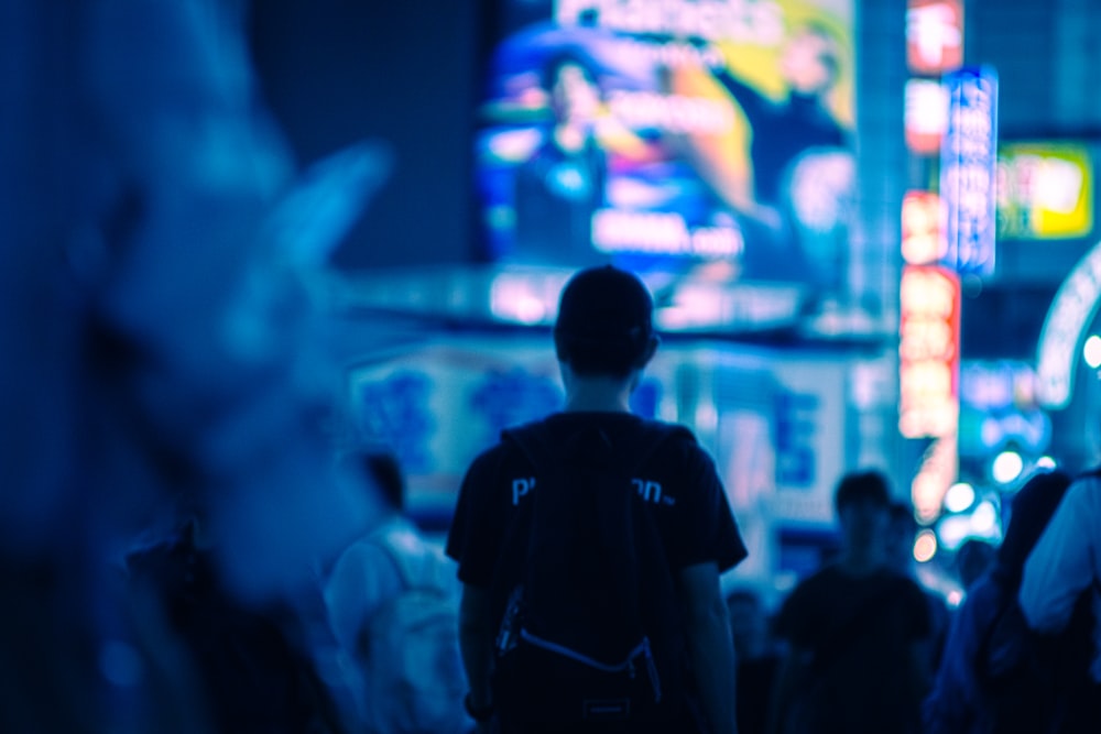 a person standing in front of a crowd of people