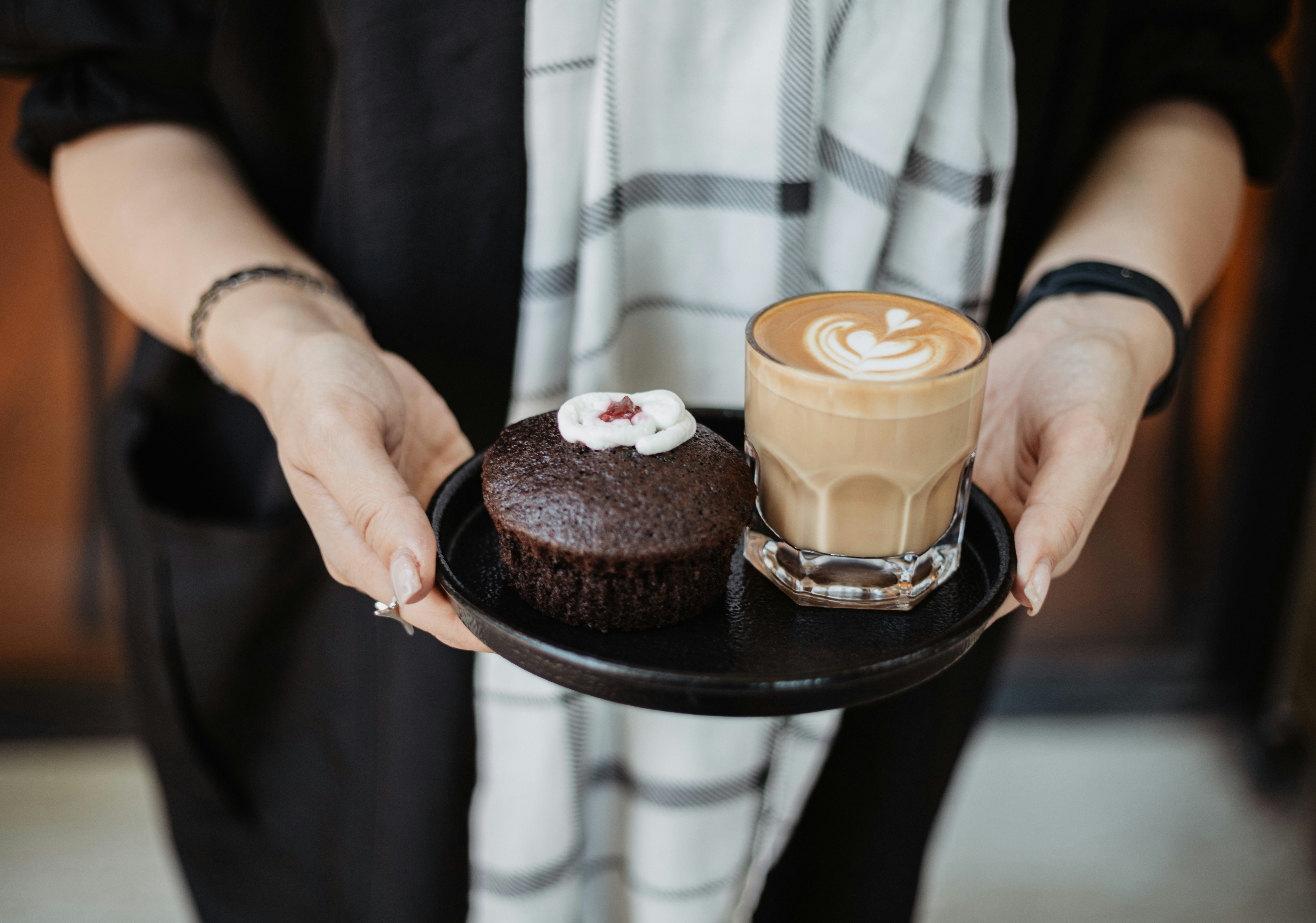 a person holding a plate with food