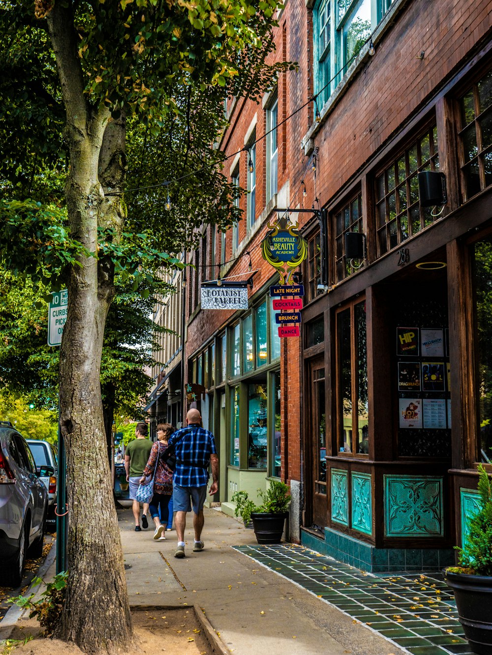 people walking on a sidewalk