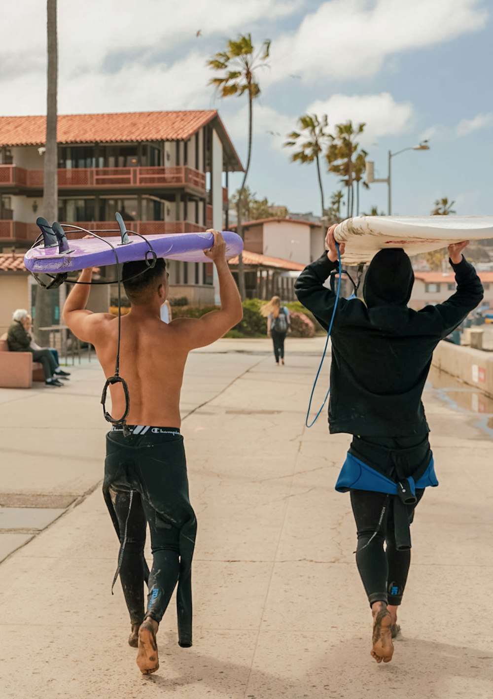 two people holding kites