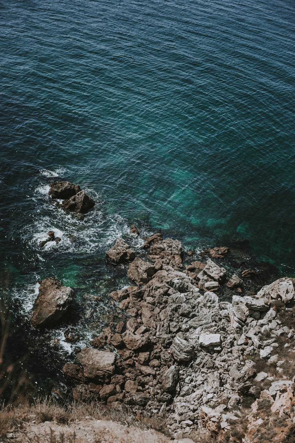 rocks and water with a beach