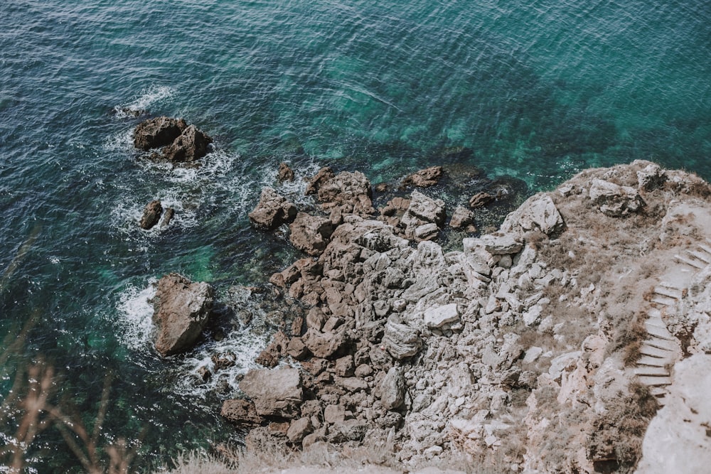 a rocky beach with water