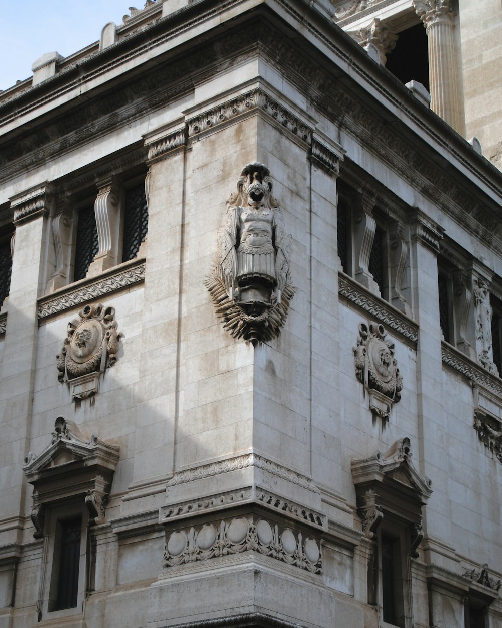 a building with statues on the side