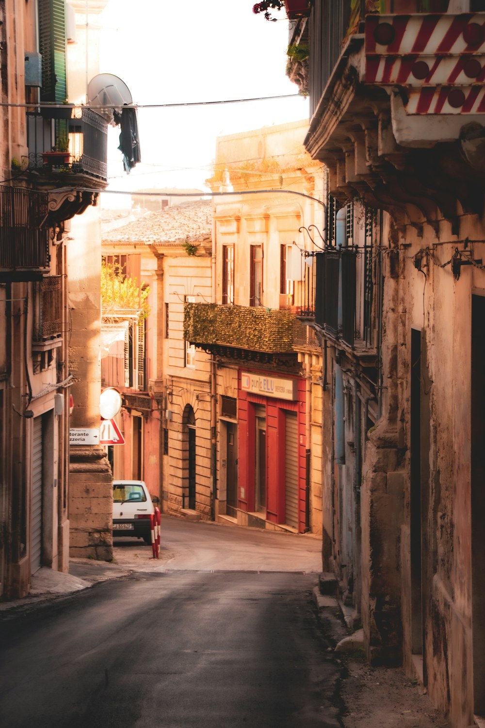 a narrow street with buildings on both sides