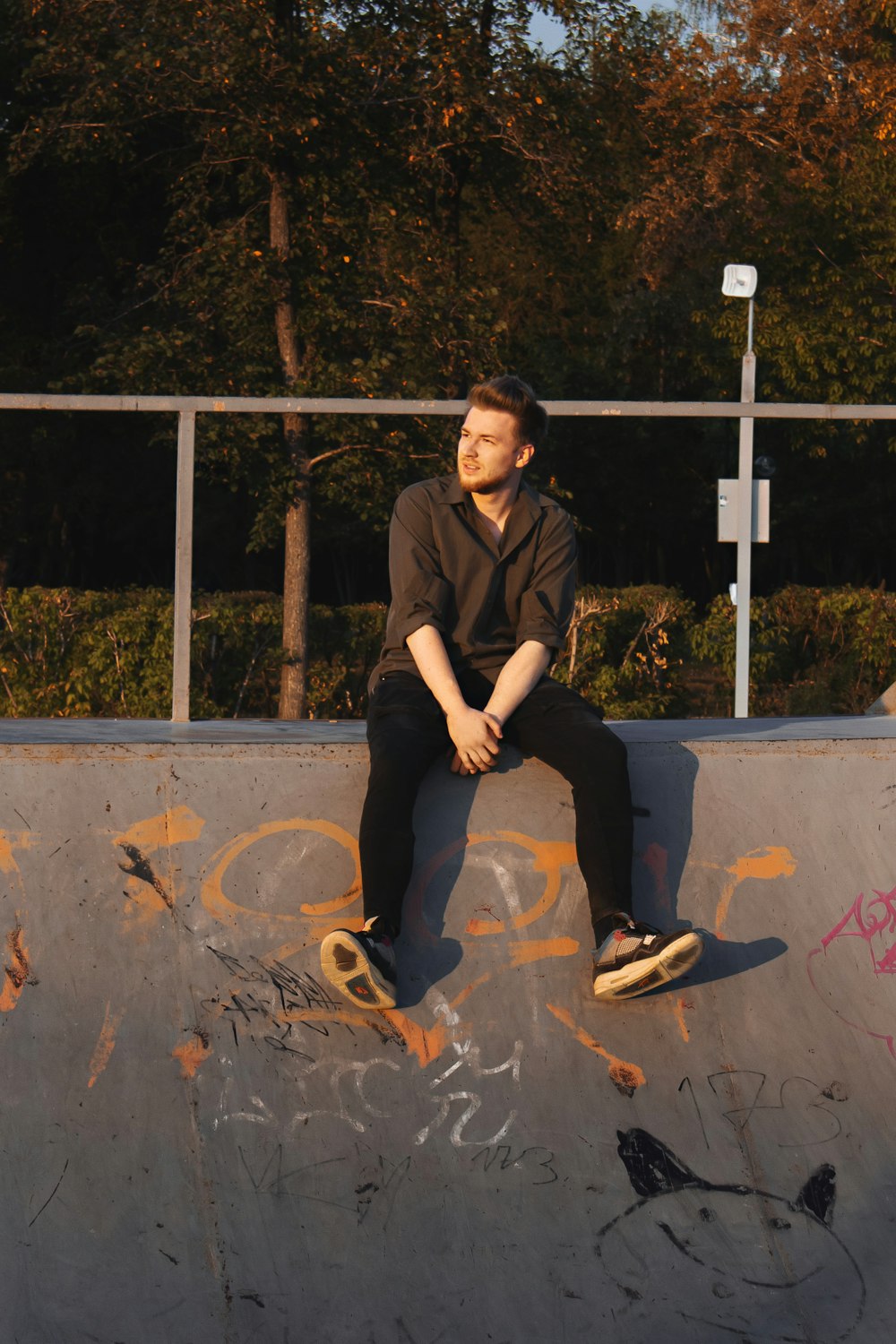 a man sitting on a skateboard
