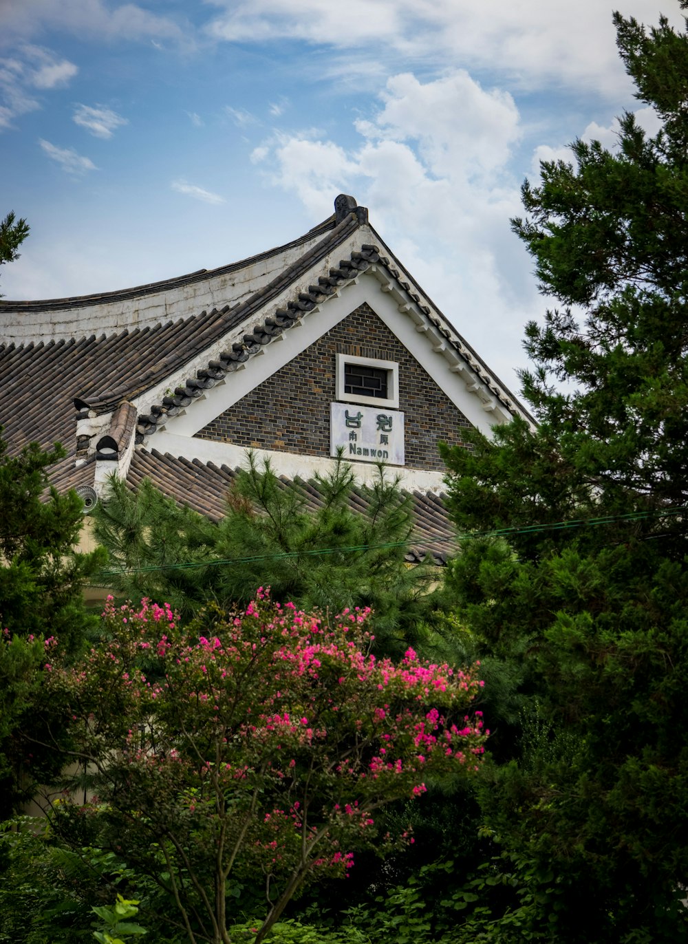 a house with a large garden in front of it