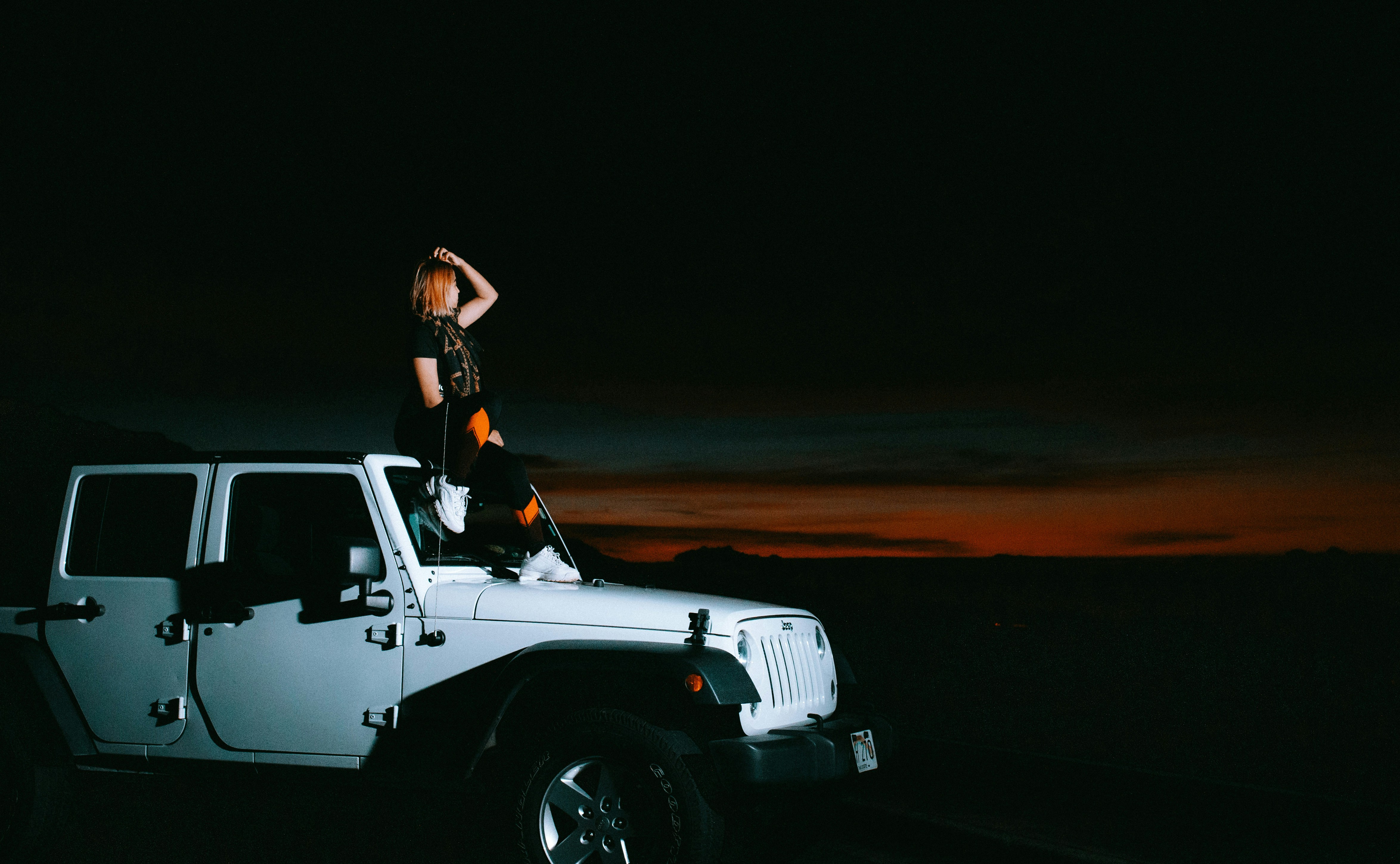 a person sitting on the back of a truck