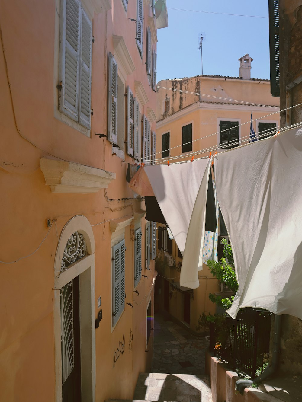 a row of buildings with white umbrellas