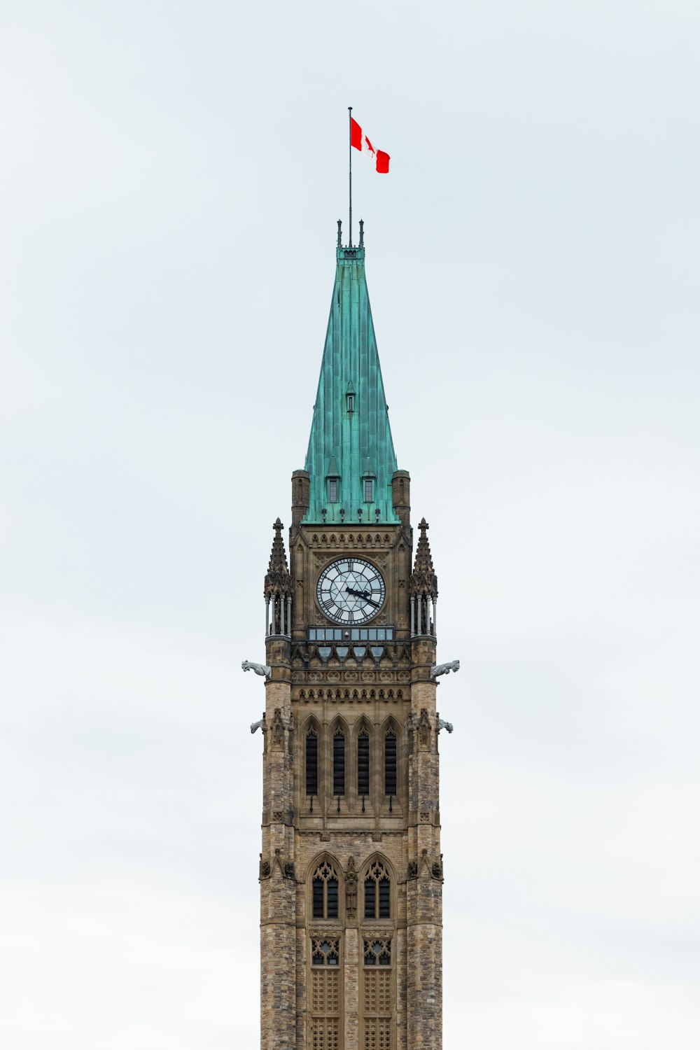 a clock tower with a flag on top