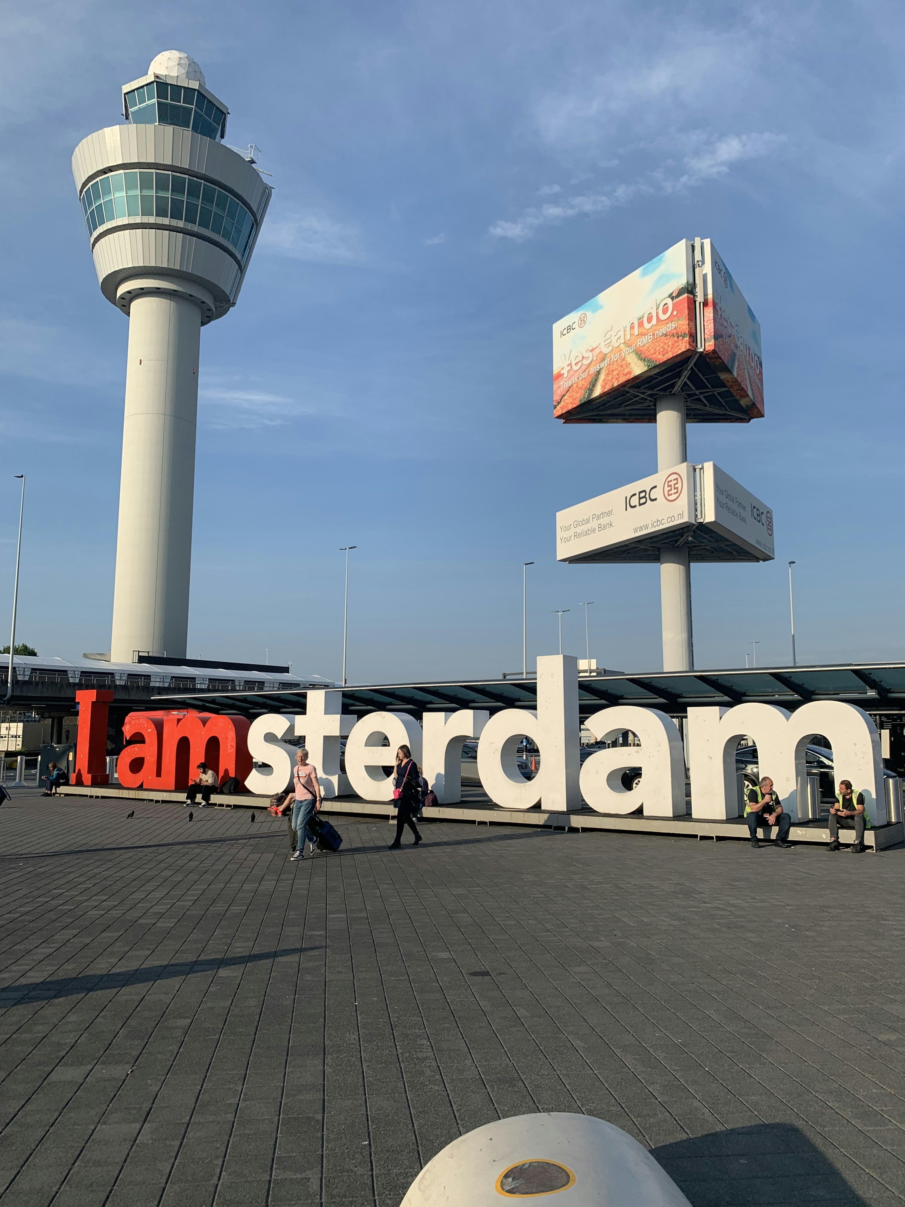 A large white tower with a sign on it photo – Free Blue Image on Unsplash