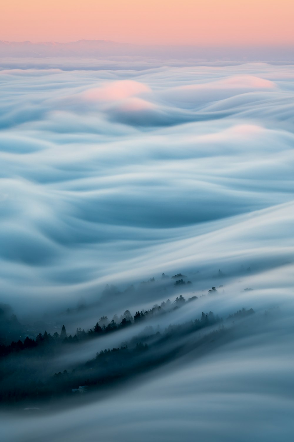 a view of a foggy landscape