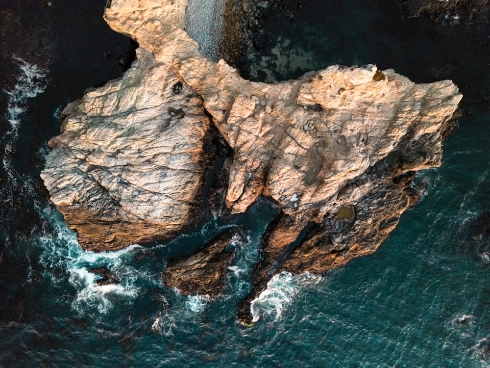 a large rock formation in the water