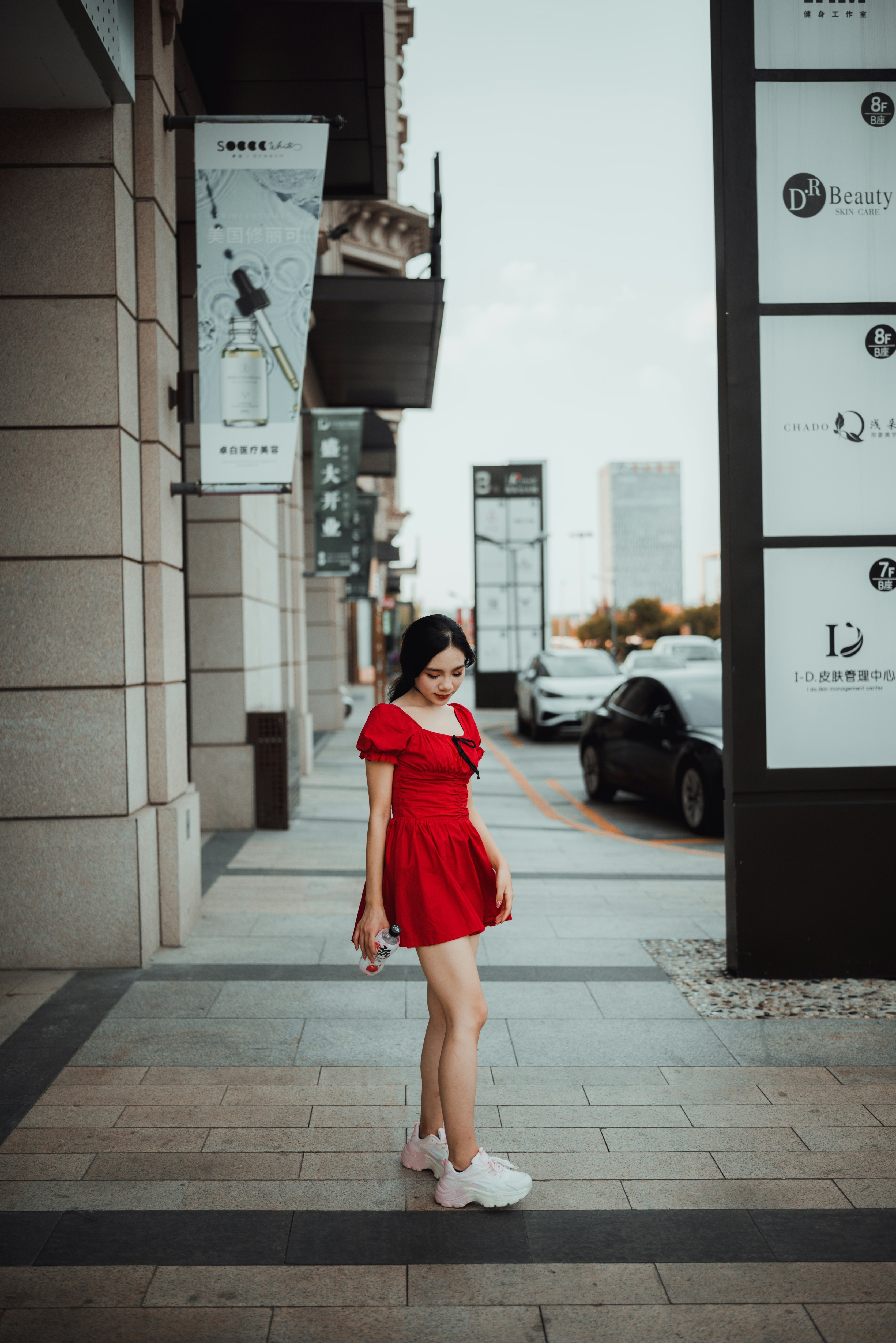 A woman in a red dress photo – Free Clothing Image on Unsplash