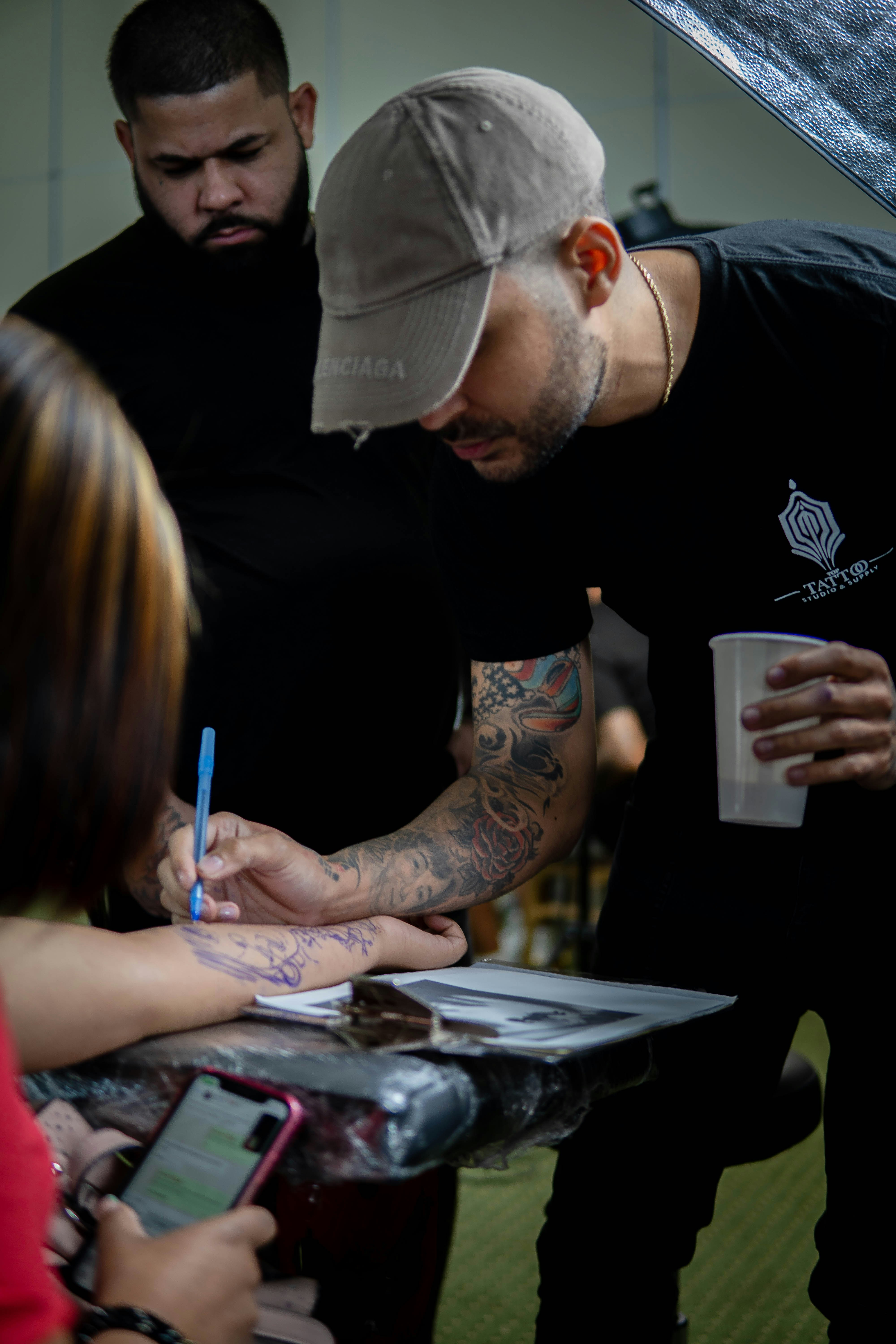 a man writing on a piece of paper
