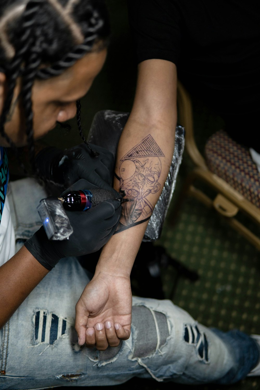 a man with tattoos on his arm