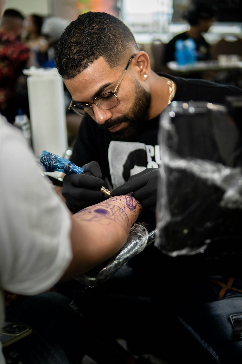 a man with tattoos on his arm