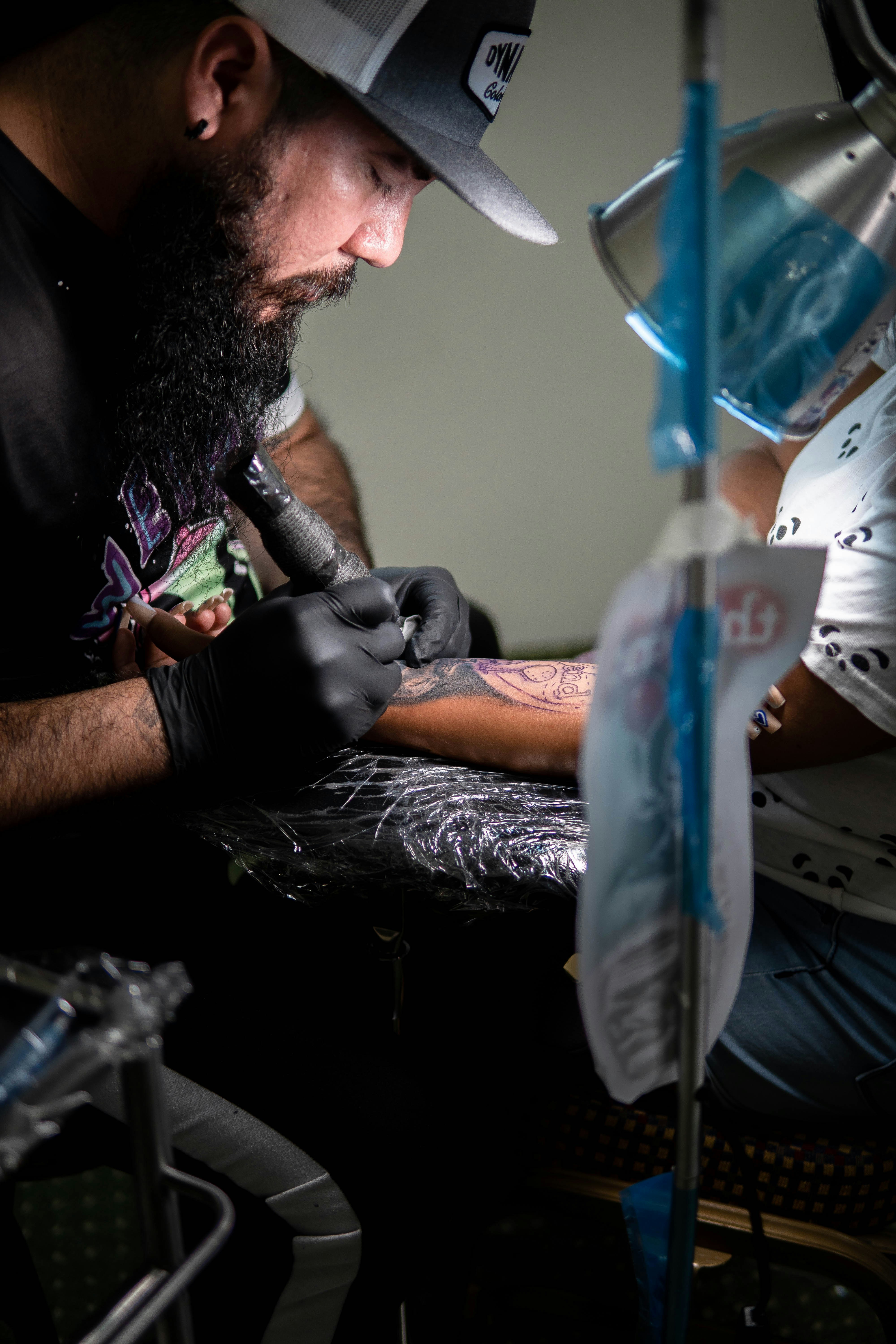 a man with a beard holding a person's leg