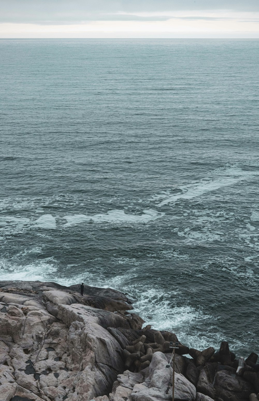 a rocky beach with waves crashing