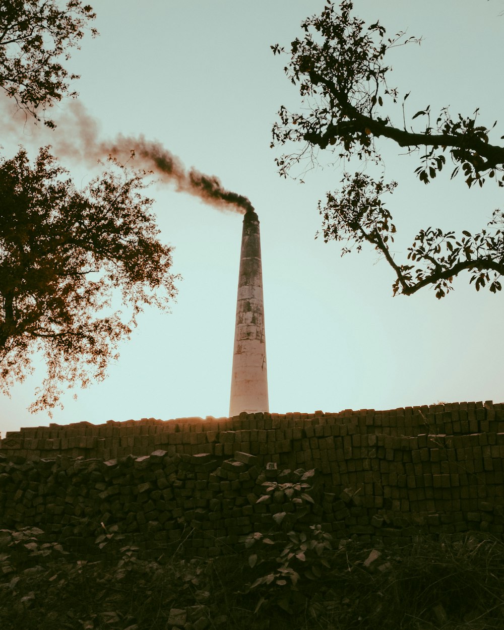 a tall tower behind a wall