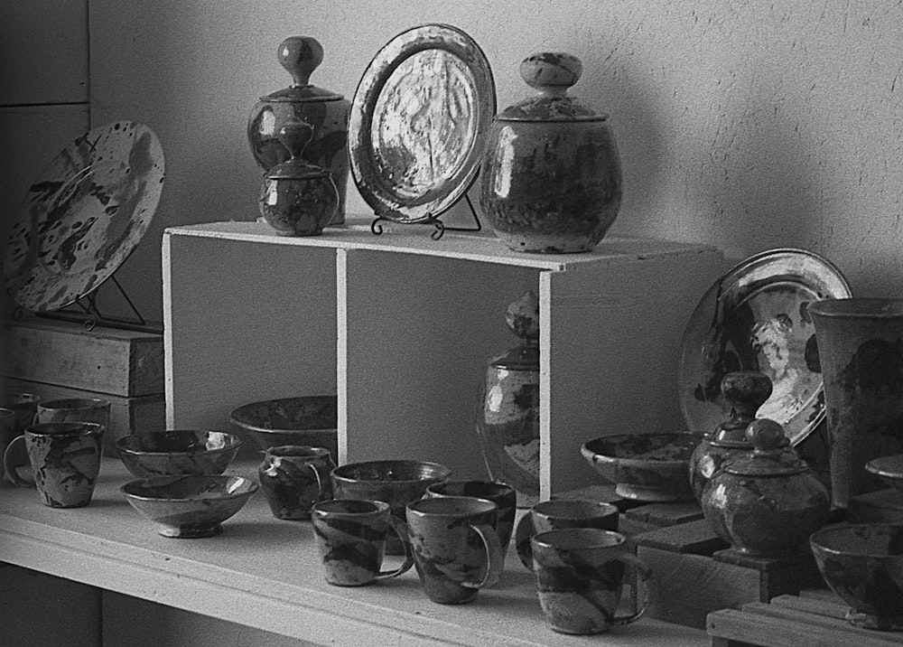 a shelf with dishes on it