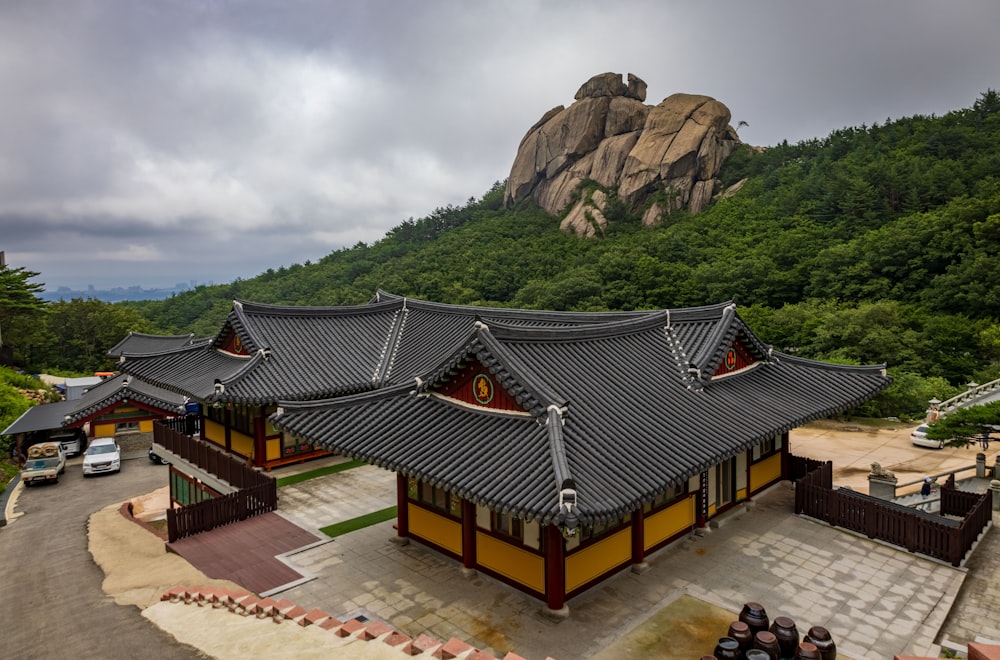 a building with a mountain in the background